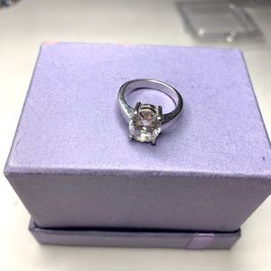 Solid silver (faux) Diamond ring in a beautiful setting.